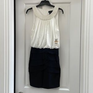 White on black cocktail/formal dress. New. Size 3/4. Designer is: B. Darlin.